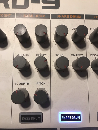 Bass drum tune on min, level on max, attack min, decay 3/4, p.depth at 11:45 roughly and pitch at 10 oclock. Snare all maxed except snappy at min