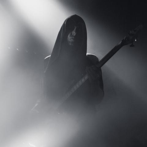 TesseracT guitarist with hoodie deep in head playing guitar at the Lutakko Club
