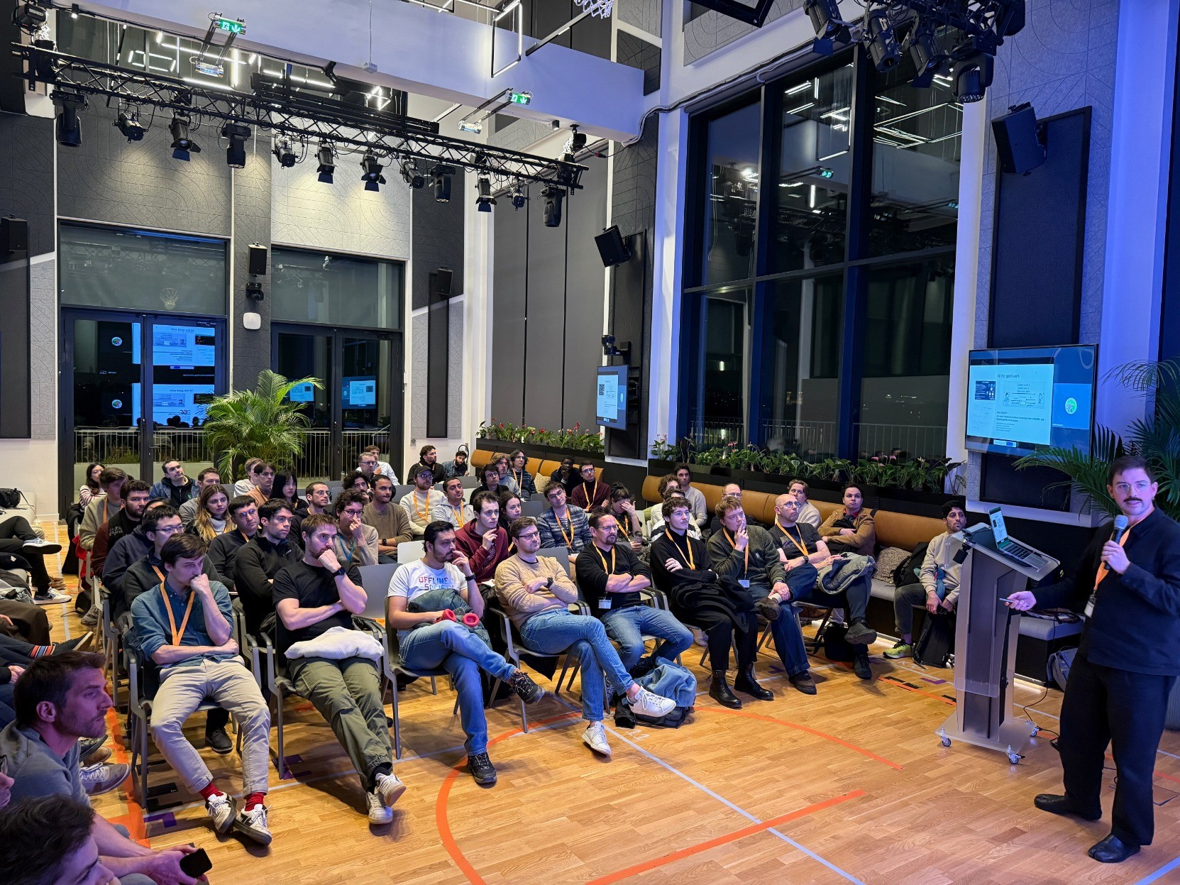 The RWC Paris Meetup 3 attendees enjoy a talk inside a nice auditorium.