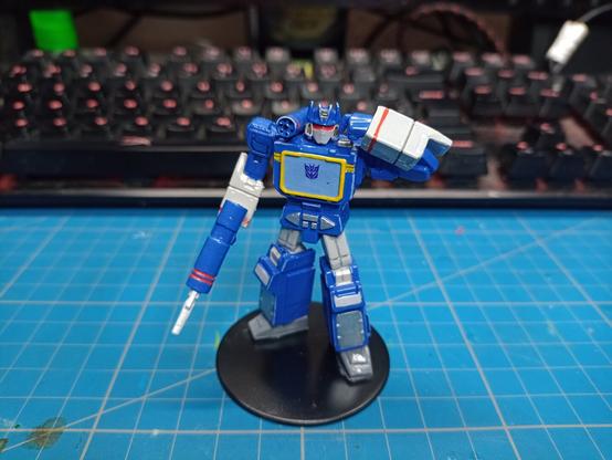 Painted miniature of Transformers Soundwave, front side view