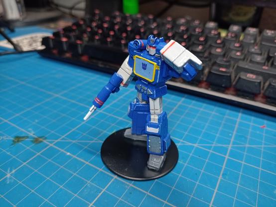 Painted miniature of Transformers Soundwave, right side view