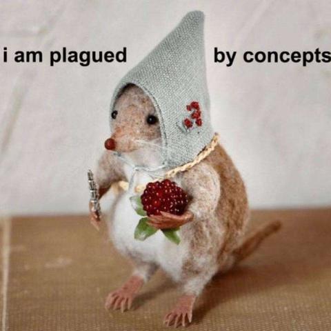 it's a strange felted mouselike creature wearing a good and holding a berry with the text "i am plagued by concepts"