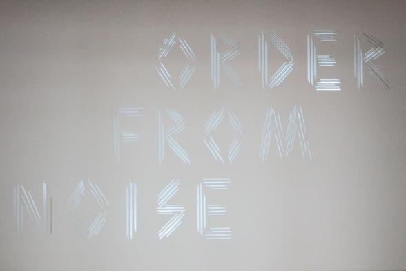inscription "order from noise"