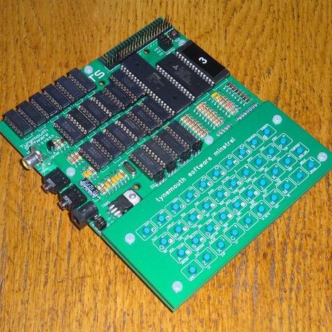 assembled Tynemouth Minstrel 3 kit. It is a green PCB with a load of black chips and a green tactile switch keyboard.