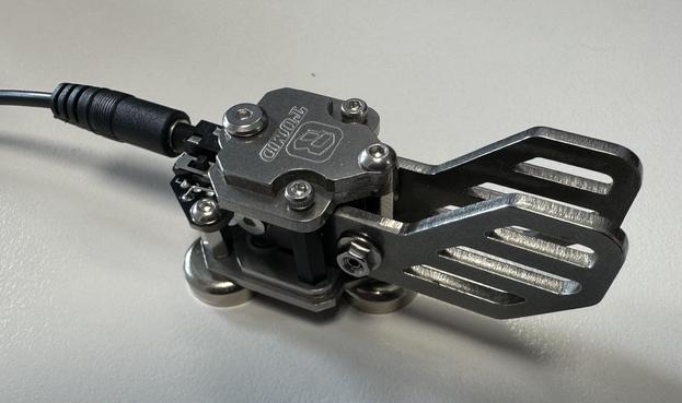 Picture of a mini Iambic key for morse code transmission. made from machined stainless steel.