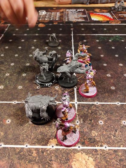 Two very disparate but very blood teams facing off on a pitch. 

On the one hand is a bunch of ogres and ghouls which are impressive and scary and most of all unpainted. On the other side are citadel blood bowl chaos chosen in transparent magenta shiny armor wearing glitter shorts and roller skates. It could not have been more expressive of the creative license you get in this game