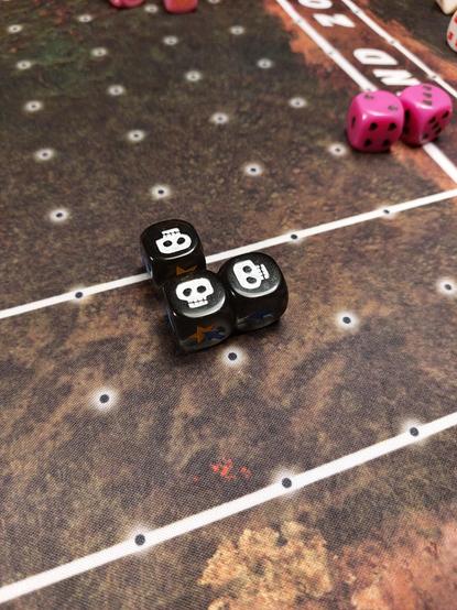 Three Black block five dice showing skulls. Yeah Ya Boi Erik rolled triple skulls