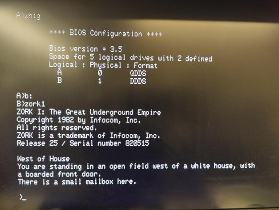 Photo of a monitor displaying a CP/M system. Output from WHIG (What Have I Got) and the first Zork game visible.