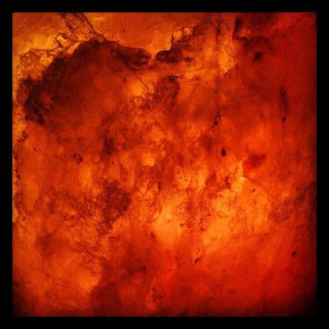 A close picture of a salt lamp that is red as hell