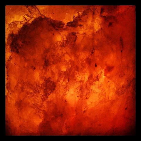 A close picture of a salt lamp that is red as hell