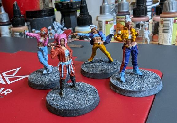 Partially painted cyberpunk miniatures from Unit 9 miniatures.