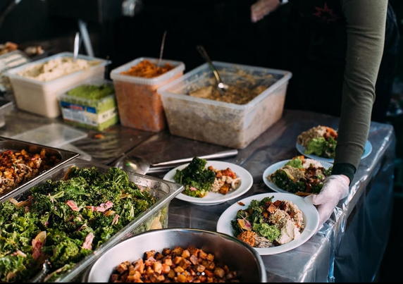 Veggie food in trays.