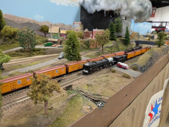 2 Southern Pacific cab-forwards passing each other near a tornado