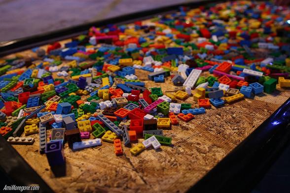 A pile of legos in a wooden pit