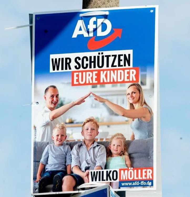 A campaign poster for the political party AfD features a family grouping. Two adults (a man and a woman) are extending their arms toward each other above three children, in what looks like Nazi salutes.