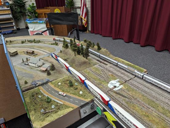 A Utah-based Road Runner train passes by a Santa Fe "Super Chief"