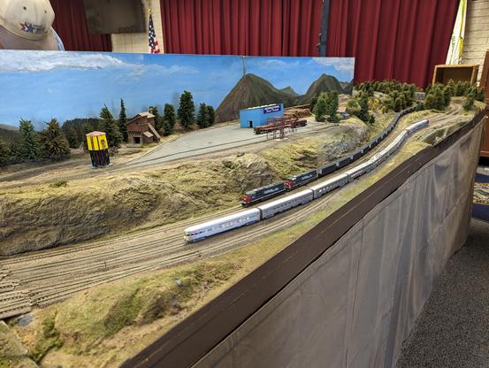 A Southern Pacific coal drag passes a Santa Fe passenger train