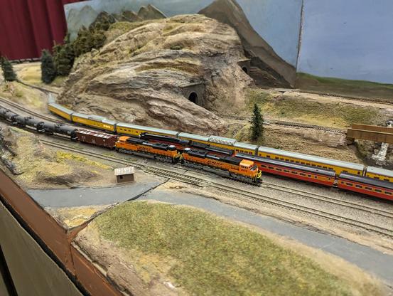 A BNSF mixed freight alongside UP and SP passenger trains