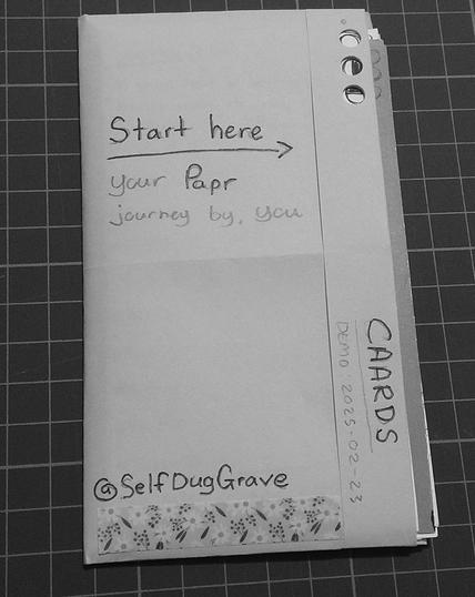 The front of "Papr" wit the text: "Start here" followed by an arrow pointing to the right. Text under reads "Your Papr journey, by you"

Side flap reads "CAARDS" and DEMO:2025-02-23

bottom reads: @SelfDugGrave