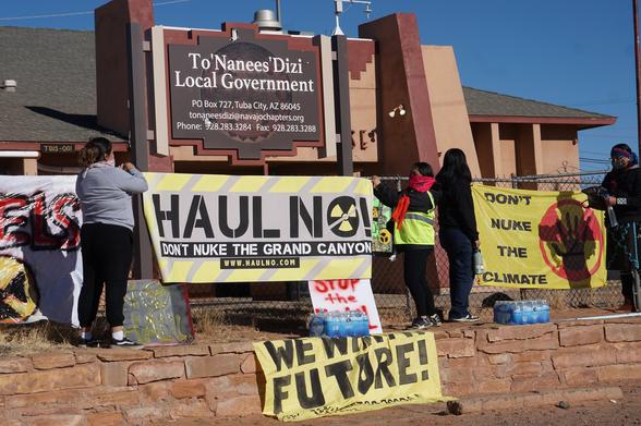 Protestors at Tuba City local government offices. They hold signs saying, HAUL NO! Don't Nuke The Grand Canyon! Don't Nuke The Planet! We are the Future!