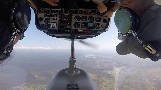 Photo from the  cockpit of an inverted aerobatic plane
