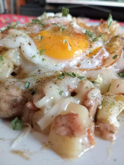 Potatoes, bacon, mushrooms, and broiled cheese, topped with a fried egg #Breakfast #Brunch