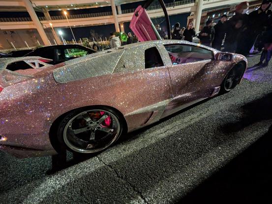 Right side view of the Lamborghini showing that the crystals are truly 100% covering the entire exterior and are arrayed in a two tone configuration with majority of the body in pink, while the "greenhouse" is white.