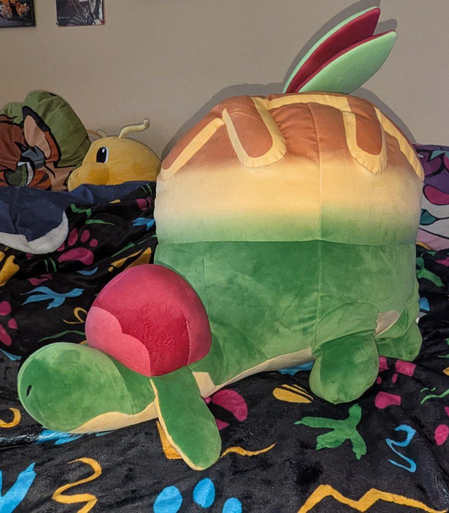A lifesize Appletun plush. It's a small dragon with an apple pie motif.