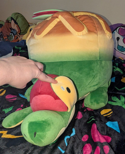 Me lifting up one of its eyestalks to show it's cute yellow eye underneath.