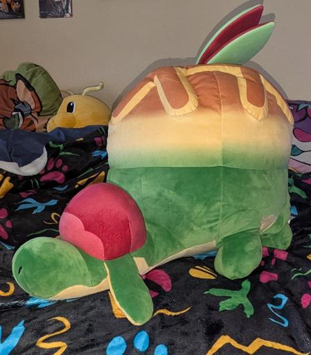 A lifesize Appletun plush. It's a small dragon with an apple pie motif.