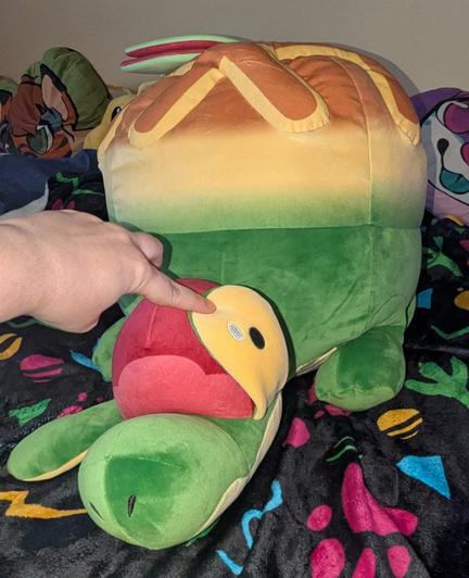 Me lifting up one of its eyestalks to show it's cute yellow eye underneath.