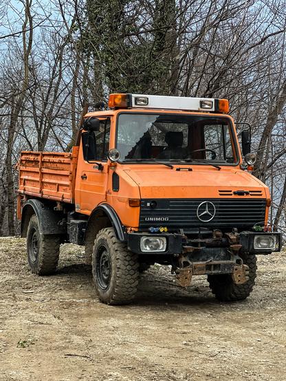 An Unimog truck. Orange.