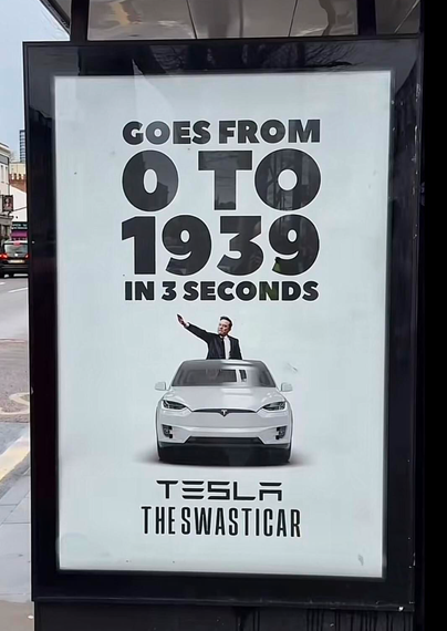 A full shot of a poster in a black frame. The poster is white and has dark text. In large letters, it reads, "GOES FROM 0 TO 1939 IN 3 SECONDS." Below that is an image of a white Tesla car, with Elon Musk standing in it, giving a Nazi salute. Below the car, it reads, "TESLA THE SWASTICAR."