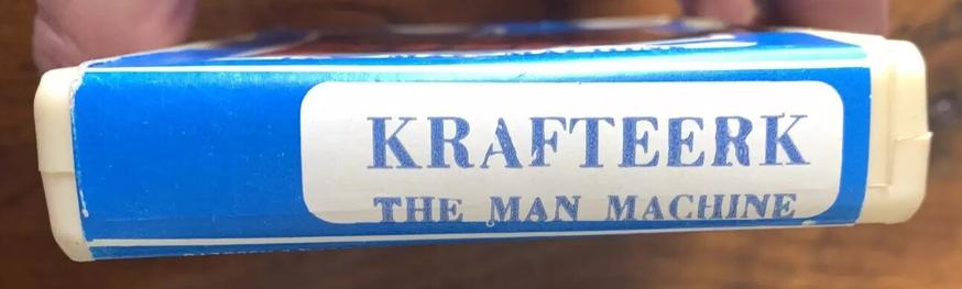 A photo of the spine of a vintage Italian 8-track tape with text as follows: "KRAFTEERK / THE MAN MACHINE".