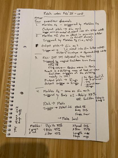 Handwitten notes describing a modular synthesizer patch. Lined white notebook page on a bamboo table.