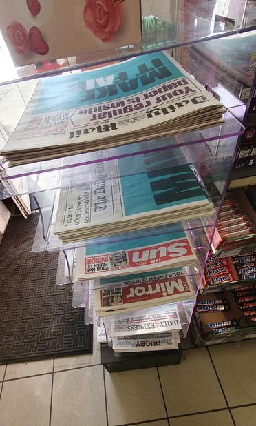 a stack of newspapers with the make it fair campaign urging the uk government not to allow ai to be trained on creative works.