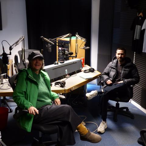 Sarah and Peter sitting in the new Resonance FM studio
