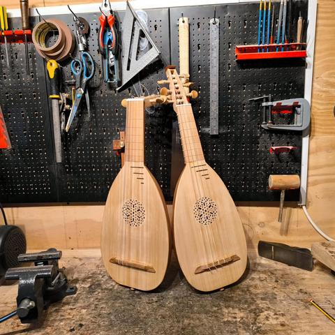 A matching pair of soprano lute and renaissance mandore I built recently for a customer, photographed together in my workshop.