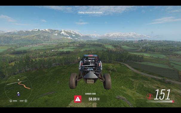 In this captivating image from a racing game, we see a moment of intense competition on a winding mountain road. The player's vehicle is prominently featured, its black and white color scheme standing out against the lush greenery of the landscape. It's currently in second place, trailing slightly behind the leading car.

The player is actively engaged in the race, with their steering wheel firmly held at an angle, indicating a sharp turn on the road. This action is reinforced by the speedometer at the bottom center of the screen, which reads "155 km/h," suggesting that they're driving at high speeds.

The game's UI, visible in the top left corner, includes several key pieces of information. The player's name is displayed, along with their current position in the race, showing them as '2nd'. There are also indicators for the player's health and performance, providing vital feedback on the ongoing action.

The environment itself is a picturesque scene of a mountain road, surrounded by trees and rolling hills, creating a sense of motion and adventure. Despite the high speeds suggested by the UI, the scene maintains a strong sense of calm, with no visible obstacles or hazards on this stretch of the track.

Overall, the image captures an exciting moment in a racing game, with the player's vehicle skillfully navigating a challenging course while being closely followed by the competition.