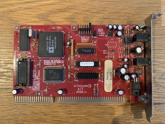 A red ISA sound card with a large chip labeled GF1.