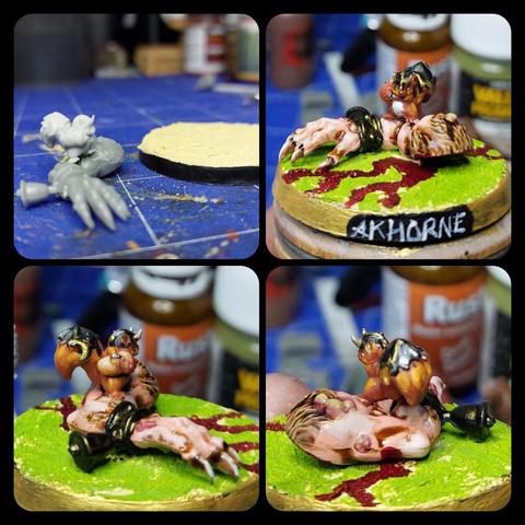 4 images of a tiny squirrel with a helmet and (inexplicably) tail armour glued to a disembodied rat ogre arm. In the first image the squirrel and arm are unpainted next to a base with basing paste on (I used a blow dryer to get that stuff solid in 4m). 

On the other 3 the things is more or less painted, with blood running across the base from the arm, and the name AKHORNE is on the base