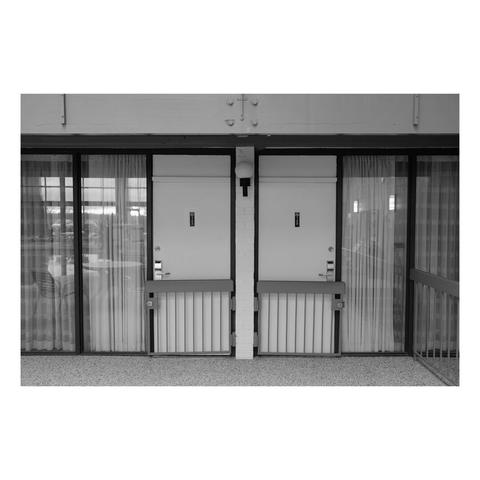 two interior hotel room doors with gates in front of them