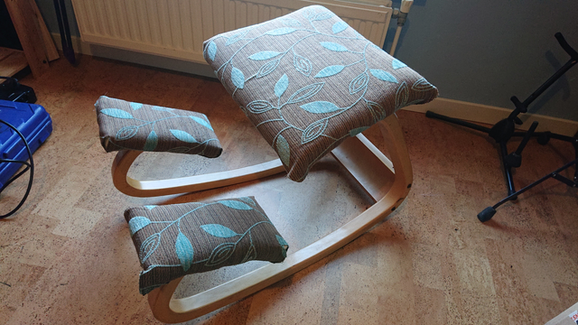 The same chair, but with a turquoise-on-brown leaf pattern. The edges still need to be sewn.