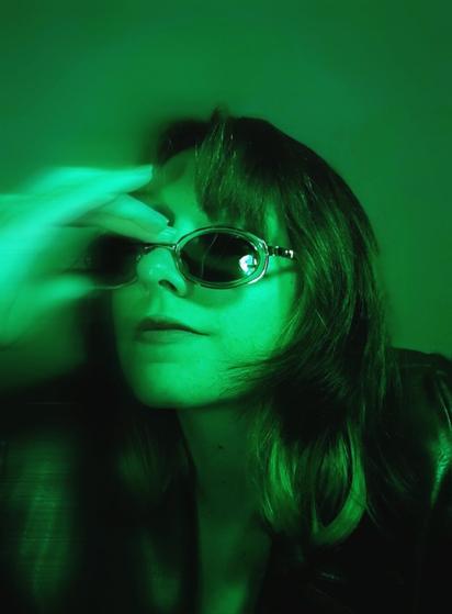 Girl under green light