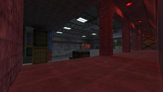 It's pretty much the same picture as before. Only from a different perspective, so that you can now see the corridor that was previously behind the previous perspective. This is illuminated with red lamps. This is on the map cs_assault in the game Counter-Strike 1.6.