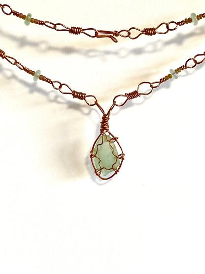 Aquamarine seaglass pendant wrapped in reclaimed copper wire on a custom wire wrapped necklace