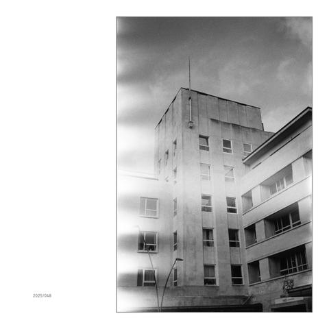 Facade of a postmodern block on Royal Parade in Plymouth. The film's light leak takes away some of the brutality of the front of this house.