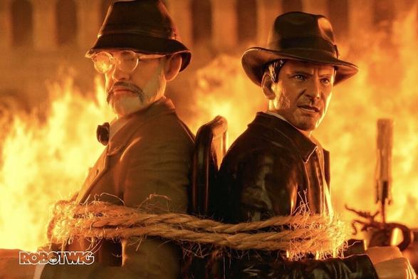 Indiana jones and Indy Sr are tied to a chair whilst the building is completely on fire
