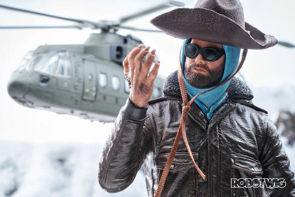 Macready looks at his mutating hand as a rescue helicopter approaches from behind.