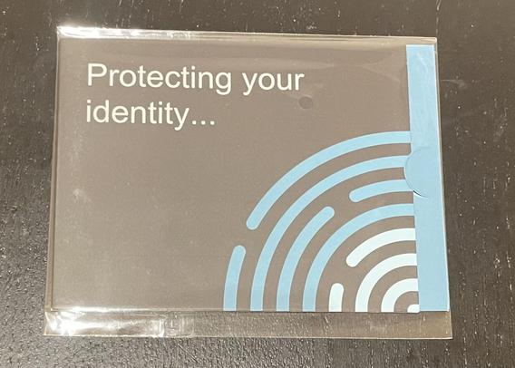 A payment card protector in black paper packaging with ‘Protecting your identity…’ written on it. In the bottom left-hand corner there is a quarter-circle graphic made up of concentric rings with breaks. To some - it looks like part of a fingerprint, but if you’re a cell biologist, it’s clearly the ER.